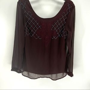 BKE Boutique red blouse with grey beading